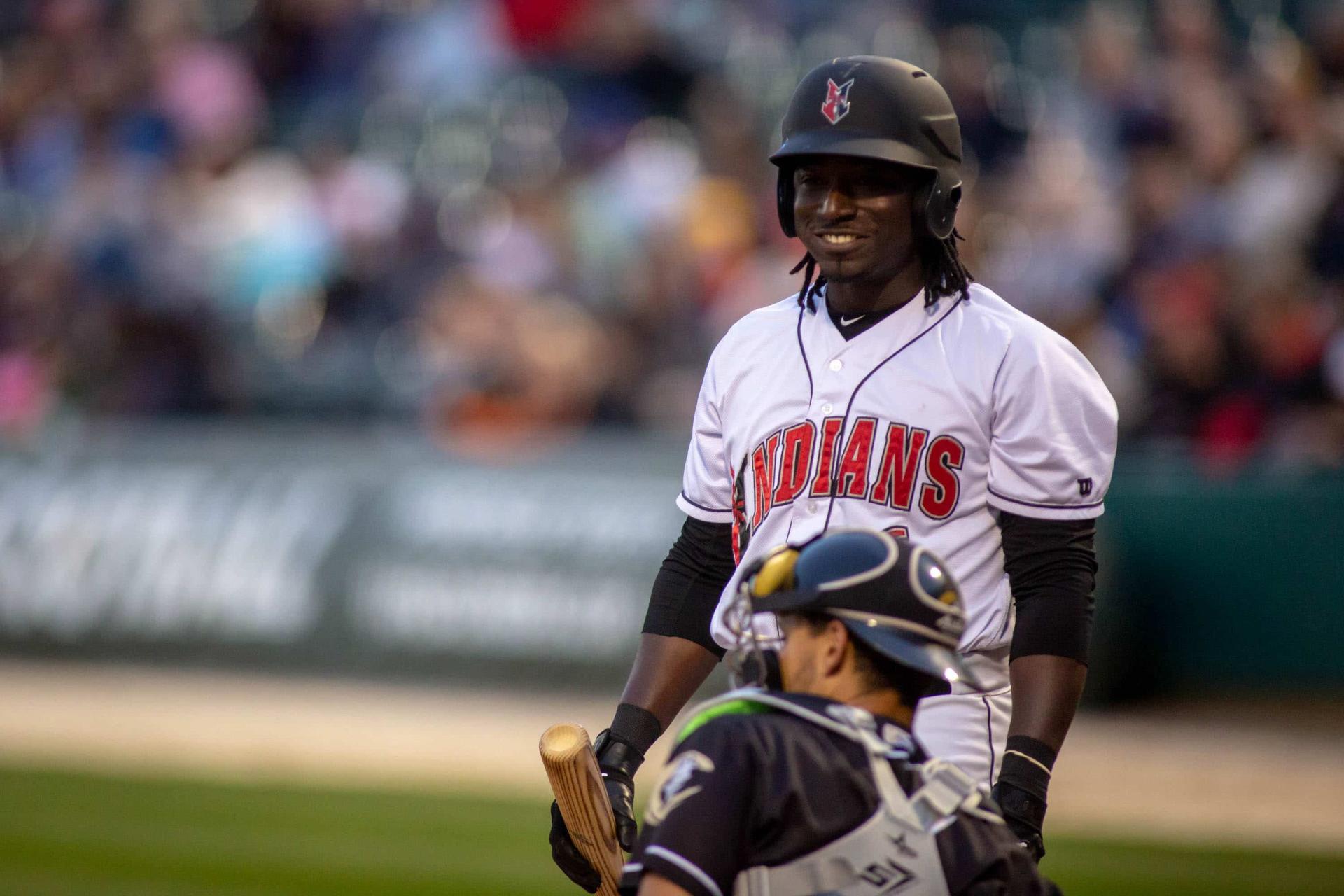 Indians batter smiling